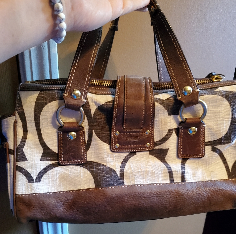 Vintage retired Coach large hand bag and matching wallet.